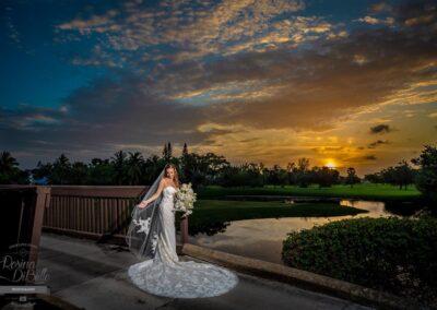 Bride on the bridge at sunset