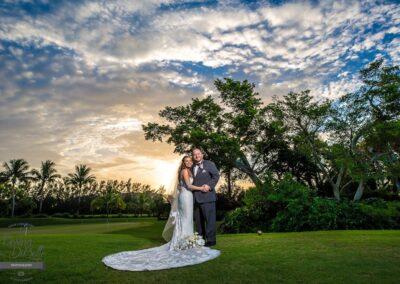 a bride and groom embracing on our south Florida golf course