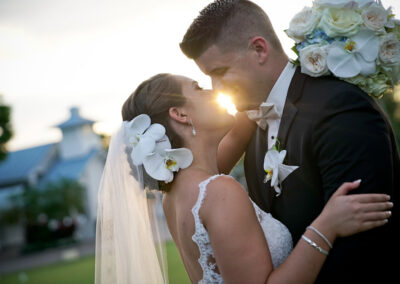 bride and groom kissing at our south Florida golf course